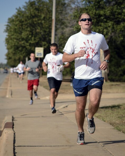Airmen run at the Zombie 5K Costume Fun Run at Vance Air Force Base, Oklahoma, Oct. 29. The run was a part of 71st Force Support Squadron’s Fall Fest afternoon party on base. (U.S. Air Force photo / David Poe)