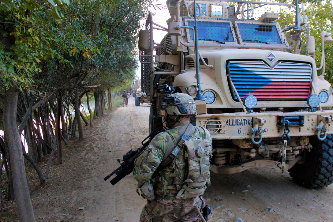 U.S. soldiers provide security as Czech and Afghan soldiers patrol and clear routes through a village in Parwan province, Afghanistan, Oct. 20, 2015. U.S. Army photo by Sgt. 1st Class David Wheeler
