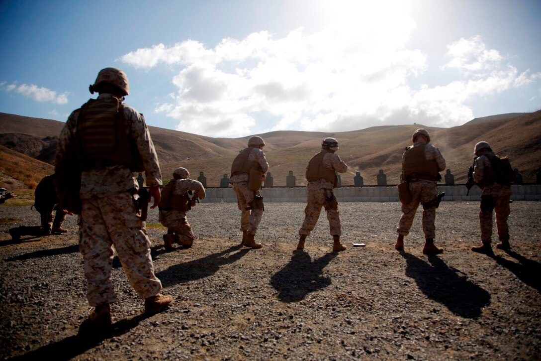 U.S. Marines with 11th Marine Expeditionary Unit (MEU) conduct firing drills as part of combat marksmanship training during the 11th MEU Command Element field exercise (CEFEX) at Camp Pendleton, Calif. Combat marksmanship training teaches Marines weapon familiarity and marksmanship enhancement, as well as maintaining developed skills in preparation for the WestPac 16-2 deployment. (U.S. Marine Corps photo by Cpl. Xzavior T. McNeal)