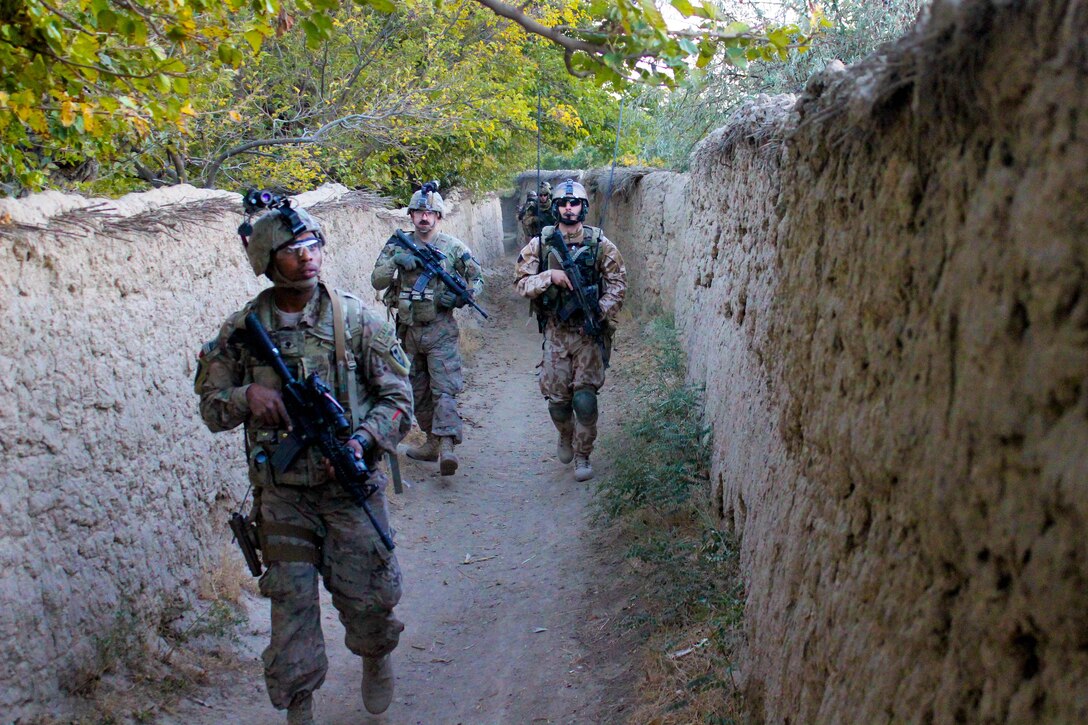 U.S., Czech and Afghan soldiers patrol and clear routes through a village in Parwan province, Afghanistan, Oct. 20, 2015. U.S. Army photo by Sgt. 1st Class David Wheeler