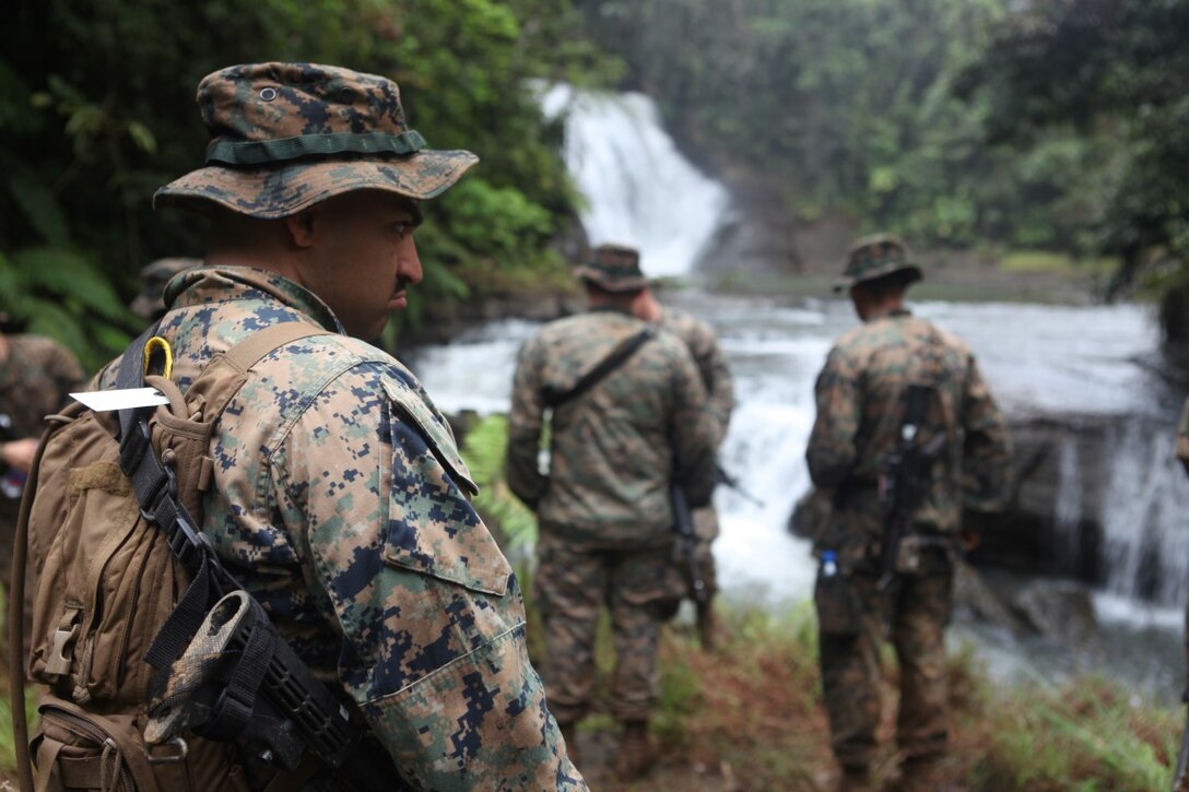 Cpl. Renatto Aguilar, administrative clerk for KOA MOANA 15-3, takes a break after hiking in the jungle during a training exercise in Namosi Province, Fiji, Oct. 13. Marines also helped build up the local communities during the evolution.
