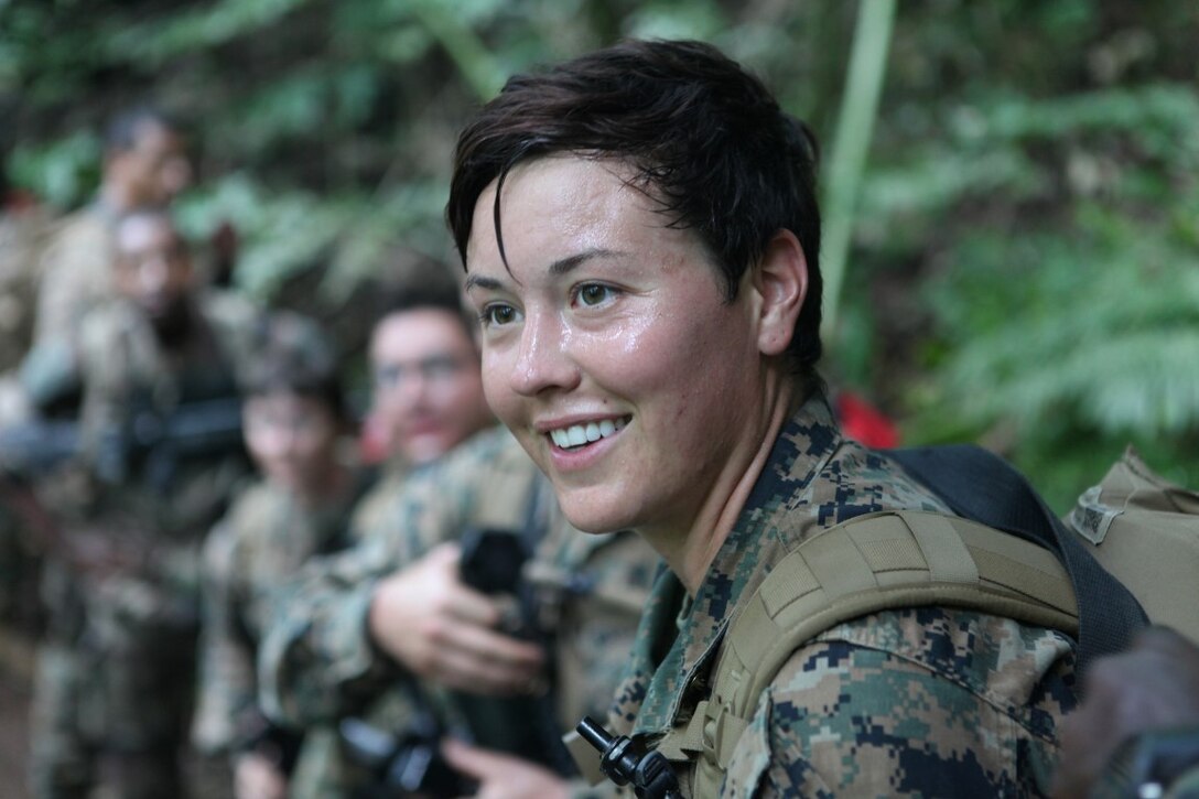 Lance Cpl. Katherine Bogomolov, a combat engineer for engineer platoon, Koa Moana 15-3, rests during a hike at Moorea Island in French Polynesia, Sept. 29. The hike included U.S. Marines and French troops and covered a span of eight kilometers as part of Koa Moana (Ocean Warrior).