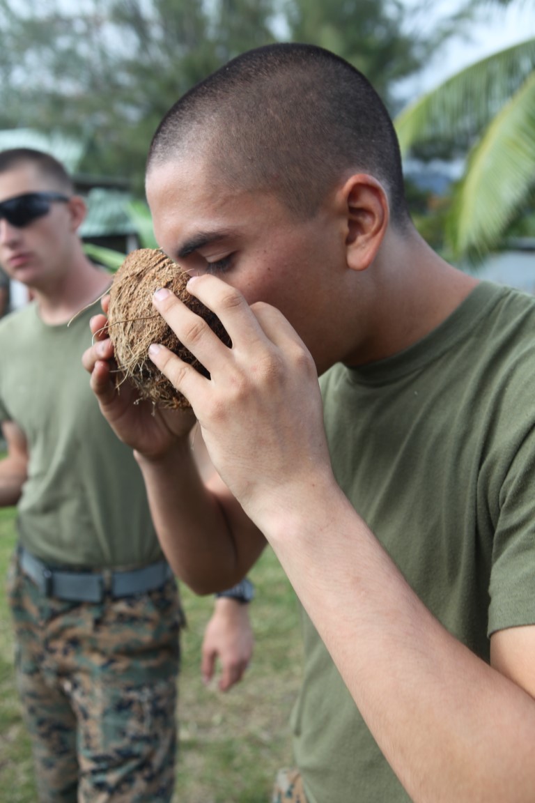 Lance Cpl. Kaedyn Griffith, a combat engineer for engineer platoon, Koa Moana 15-3, drinks coconut water during a cultural event in Tahiti, Oct. 1. Koa Moana (Ocean Warrior) aims to enhance senior military leader engagements between allied and partner nations, and also provides an opportunity for cultural insight between participating nations.