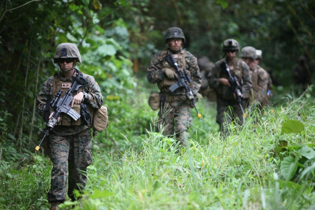Cpl. Sierra L. Wittig, squad leader for engineer platoon, Koa Moana 15-3, is at the front of a patrol during a theater security cooperation training exercise in Tahiti, Oct. 1. Koa Moana (Ocean Warrior) is scheduled to take place in Honduras, Tahiti, Fiji, Vanuatu, Kiribati and Timor Leste to enhance senior military leader engagements between allied and partner nations.