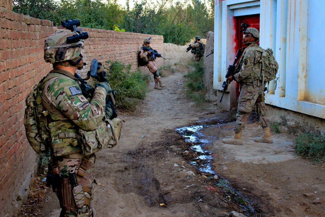 U.S., Czech and Afghan soldiers take a break while patrolling through a village in Parwan province, Afghanistan, Oct. 20, 2015. U.S. Army photo by Sgt. 1st Class David Wheeler