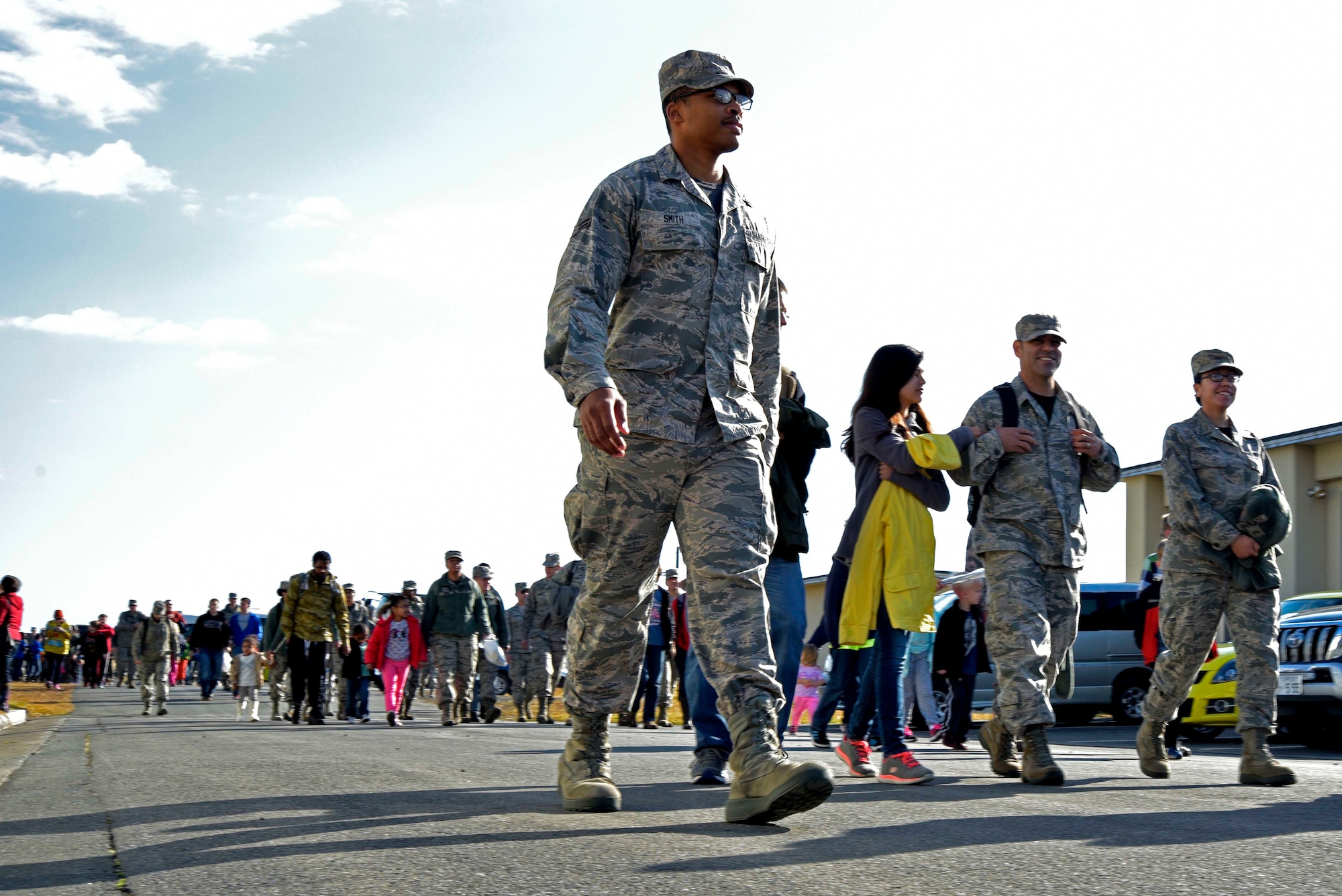 Airmen and families from the 35th Fighter Wing arrive at the Range Day event hosted by the 35th Operations Group at Draughon Range outside Misawa Air Base, Japan, Oct. 30, 2015. The event allowed service members and families to see firsthand how 35 FW and Japan Air Self-Defense Force pilots train and conduct flight operations. (U.S. Air Force photo by Senior Airman Jose L. Hernandez-Domitilo/Released)