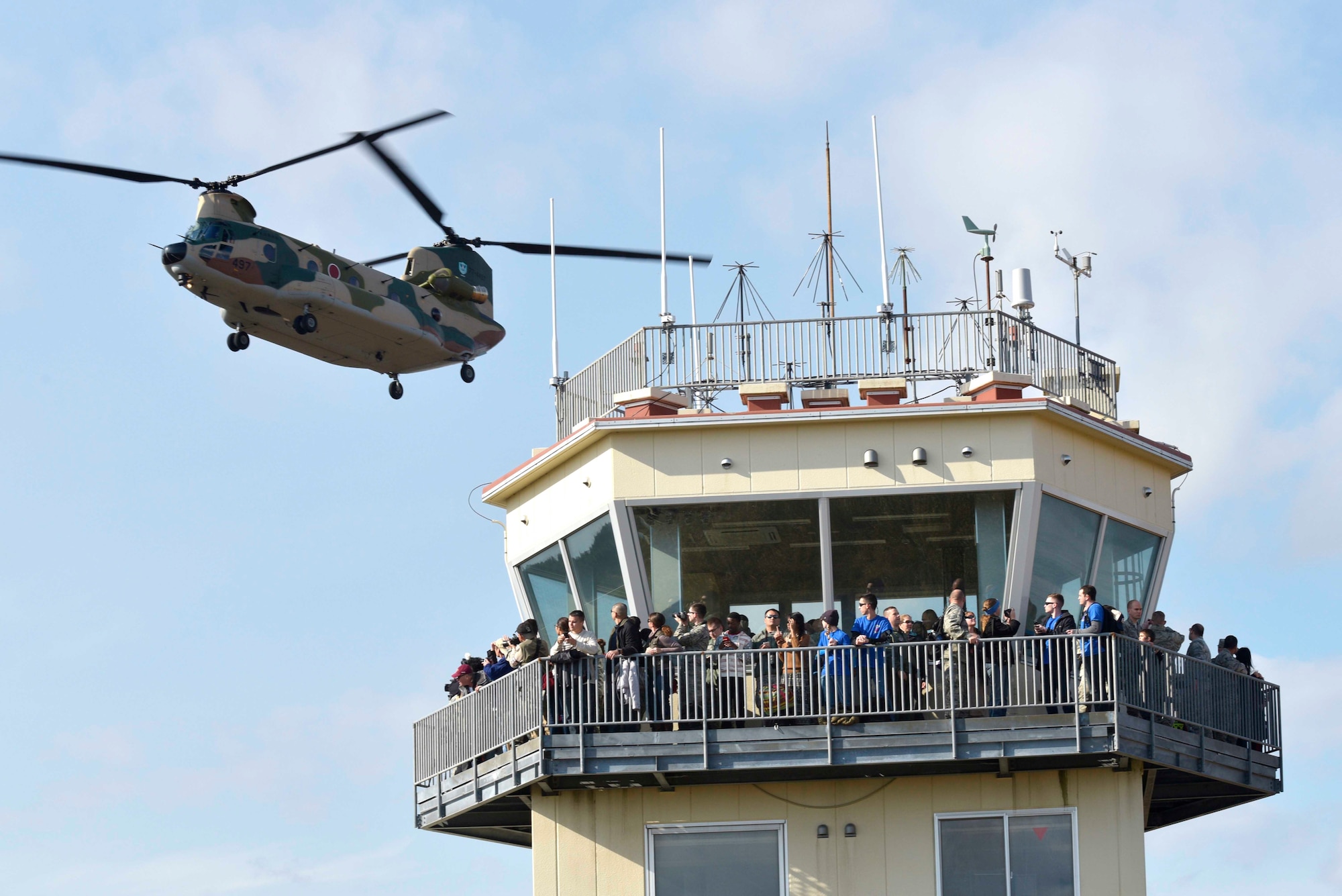 A Japanese Air Self-Defense Force CH-47 Chinook flies over the air traffic control tower at Draughon Range outside Misawa Air Base, Japan, Oct. 30, 2015. The event included aircraft demonstrations by the F-16 Fighting Falcon, CH-47 Chinook, Mitsubishi F-2. (U.S. Air Force photo by Senior Airman Jose L. Hernandez-Domitilo/Released)