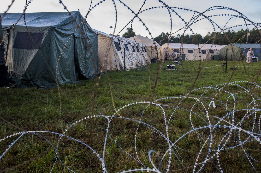 Multiple tents connect to create a Combat Operations Center during a 2nd Marine Division Command Post Exercise at Camp Lejeune, N.C., Oct. 29, 2015. The purpose of the CPX is to test the division’s ability to set up a communications network in any environment that would be used to allow the division commander to command and control his Marines. (U.S. Marine Corps photo by Cpl. Kirstin Merrimarahajara/Released)