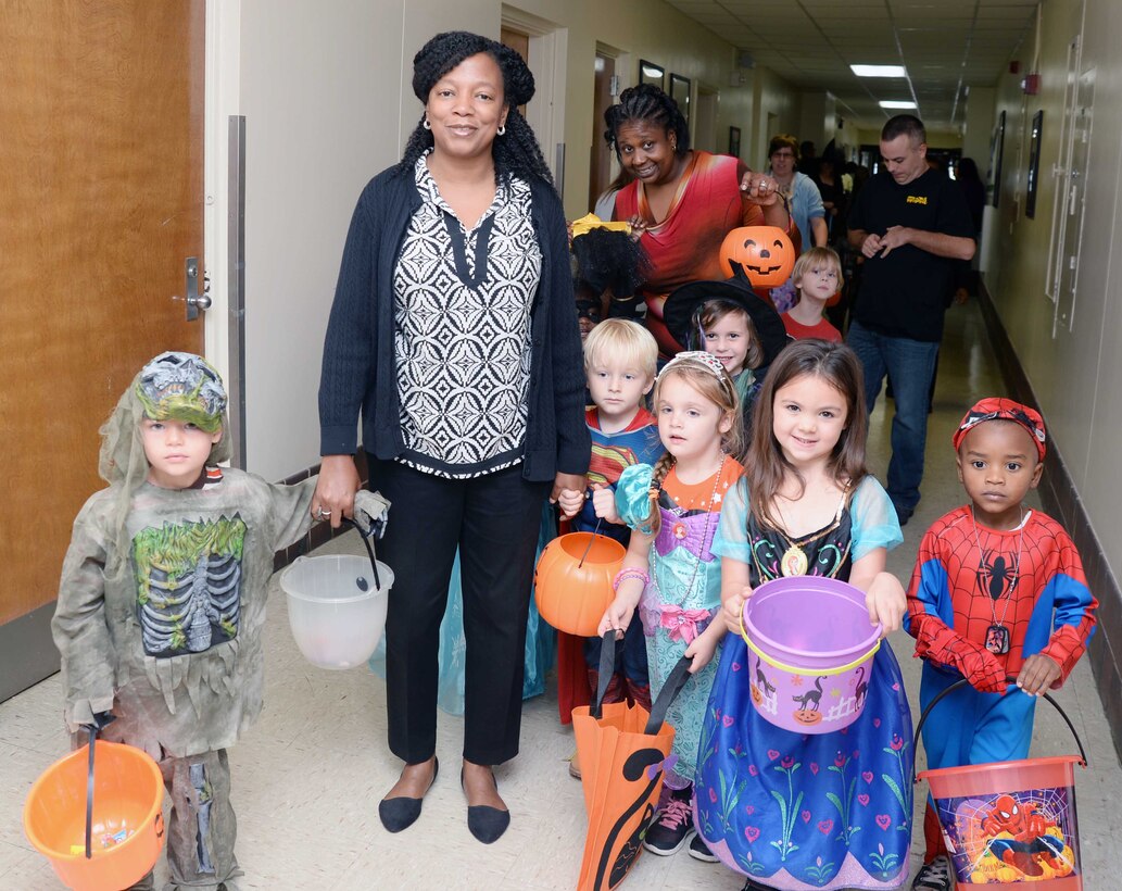 Numerous costumed toddlers from Marine Corps Logistics Base Albany’s Child Development Center celebrate Halloween in the hallways of Buildings 3500 and 3700, Oct. 29. “Trick-or-treat” rang out from the youngsters as they paraded past office doors, stopping for candy handouts from Marines, civilian-Marines and contractors.