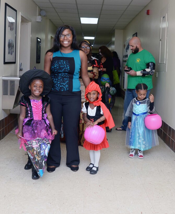 Numerous costumed toddlers from Marine Corps Logistics Base Albany’s Child Development Center celebrate Halloween in the hallways of Buildings 3500 and 3700, Oct. 29. “Trick-or-treat” rang out from the youngsters as they paraded past office doors, stopping for candy handouts from Marines, civilian-Marines and contractors.
