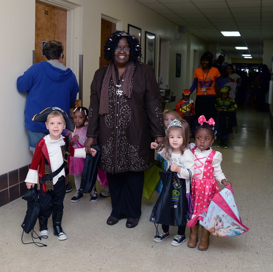 Numerous costumed toddlers from Marine Corps Logistics Base Albany’s Child Development Center celebrate Halloween in the hallways of Buildings 3500 and 3700, Oct. 29. “Trick-or-treat” rang out from the youngsters as they paraded past office doors, stopping for candy handouts from Marines, civilian-Marines and contractors.