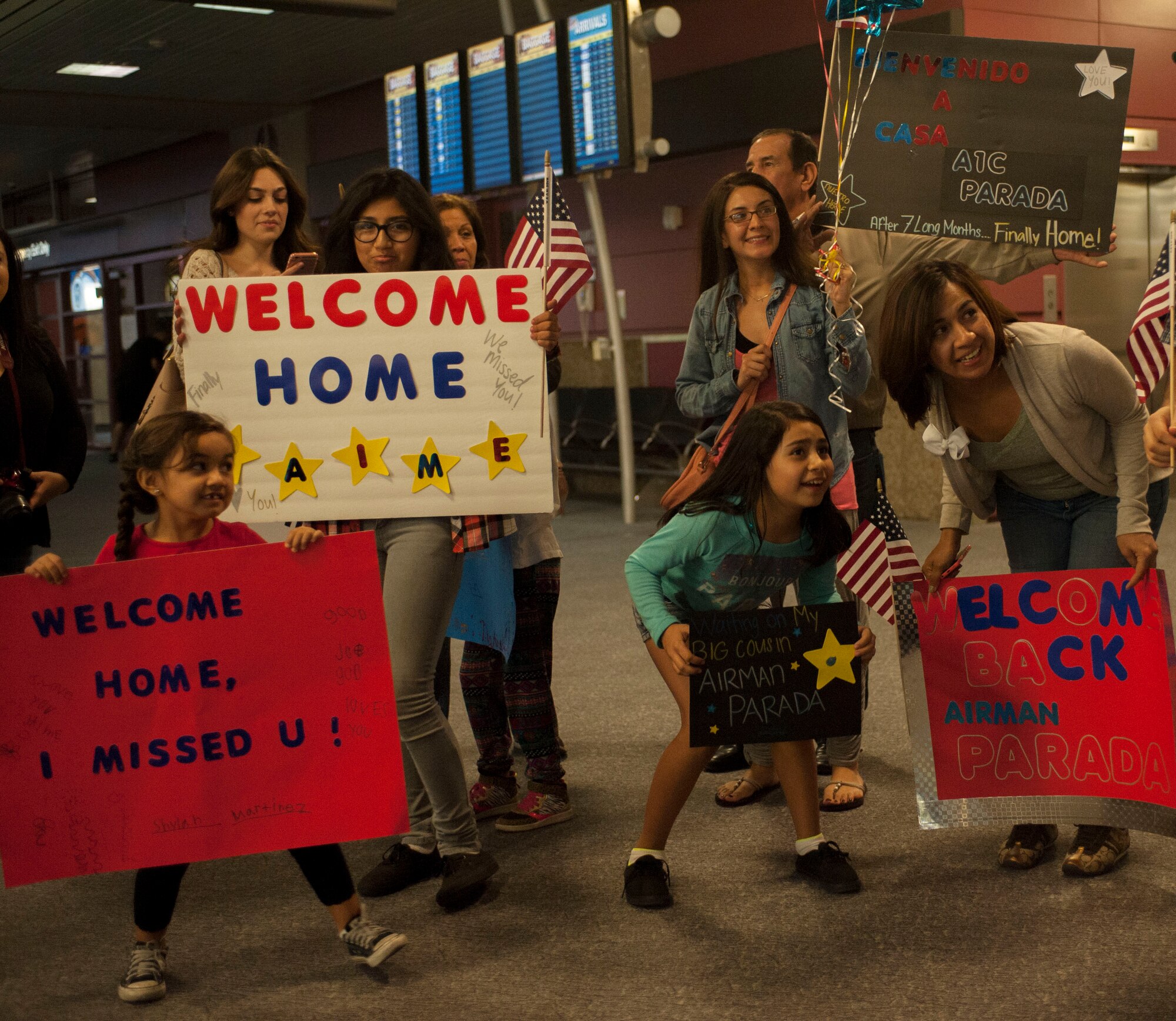 Family members of Senior Airman Jaime Parada, 926th Security Forces Squadron, wait for his arrival at McCarran International Airport in Las Vegas, Oct. 22. Parada was returning from a 7-month deployment to Southwest Asia.  (U.S. Air Force photo by Airman 1st Class Jake Carter)