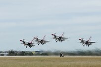 The U.S. Air Force Aerial Demonstration Squadron “Thunderbirds” take off prior to performing F-16 acrobatic maneuvers Oct. 29, 2015 at Joint Base San Antonio-Randolph, Texas. The Thunderbirds team members arrived in preparation for the 2015 JBSA-Randolph Air Show and Open House to be held Oct. 31 and Nov. 1.  Air shows allow the Air Force to display the capabilities of our aircraft to the American taxpayer through aerial demonstrations and static displays and allowing attendees to get up close and personal to see some of the equipment and aircraft used by the U.S. military today.  (U.S. Air Force photo by Melissa Peterson)