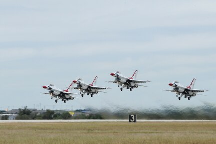 The U.S. Air Force Aerial Demonstration Squadron “Thunderbirds” take off prior to performing F-16 acrobatic maneuvers Oct. 29, 2015 at Joint Base San Antonio-Randolph, Texas. The Thunderbirds team members arrived in preparation for the 2015 JBSA-Randolph Air Show and Open House to be held Oct. 31 and Nov. 1.  Air shows allow the Air Force to display the capabilities of our aircraft to the American taxpayer through aerial demonstrations and static displays and allowing attendees to get up close and personal to see some of the equipment and aircraft used by the U.S. military today.  (U.S. Air Force photo by Melissa Peterson)
