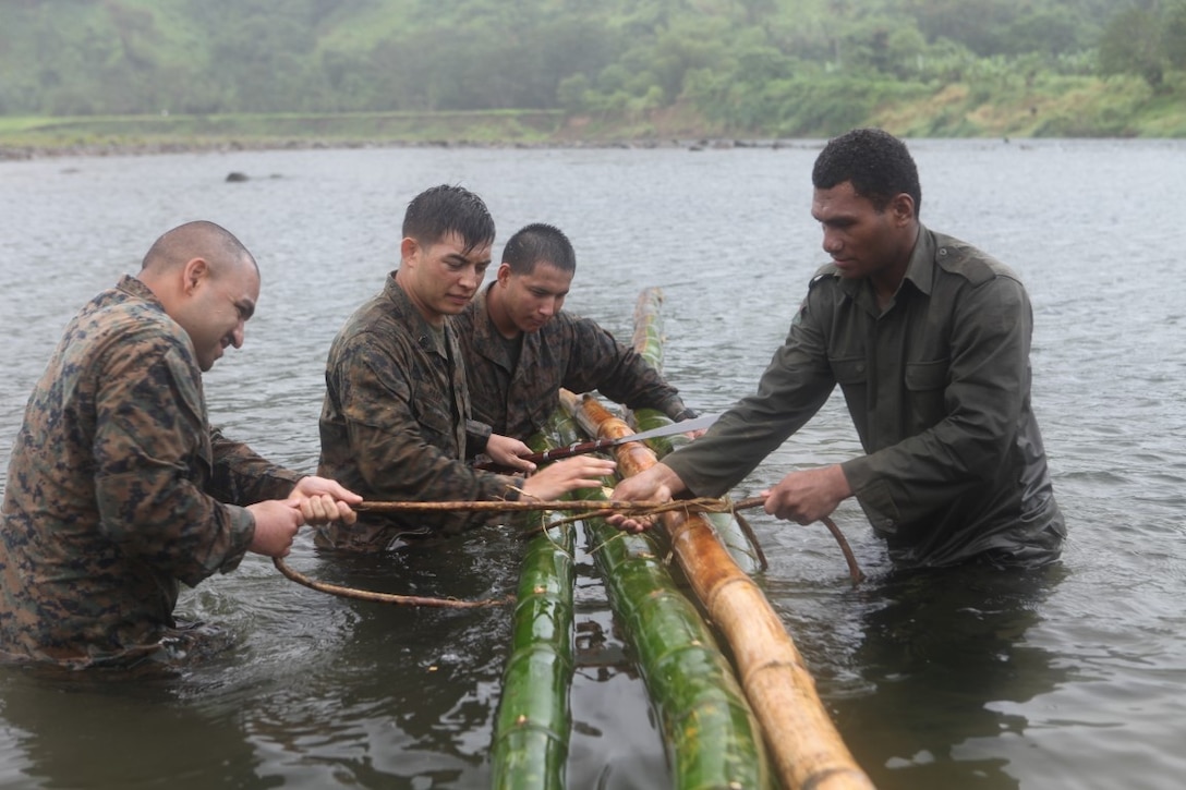 Marines learn how to build a raft made out of bamboo during a training exercise in Namosi Province, Fiji, Oct. 14. Marines trained with members of the Republic of Fiji Military Force.