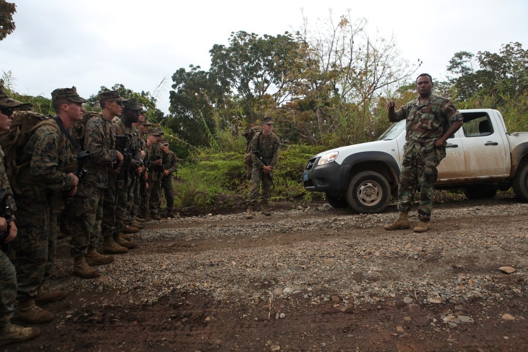 Maj. Henry Macomber, a commander with the Republic of Fiji Military Force, addresses Marines of KOA MOANA 15-3 prior to a training exercise in Namosi Province, Fiji, Oct. 11. Marines and members of the RFMF conducted jungle training exercises, jungle survival and community projects during the week.