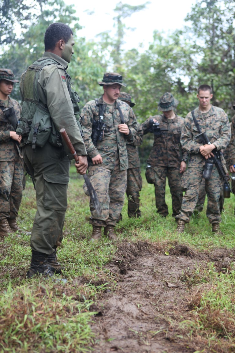 Lance Cpl. Tati Momo, a soldier with the Republic of Fiji Military Force, instructs a group of Marines about jungle survival during a training exercise in Namosi Province, Fiji, Oct. 13. Marines conducted exercises with the RFMF for four days and four nights in the jungles of Fiji.