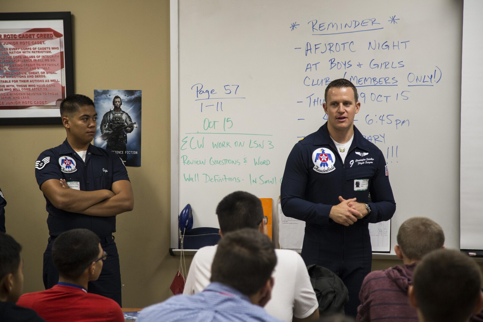 Staff Sgt. Matthew Gips(left), Thunderbirds knowledge operations manager, and Maj. Christopher Scheibler, Thunderbirds flight surgeon, speak to Judson High School Junior Reserve Officers’ Training Corps students Oct. 30 in San Antonio, Texas.  The Thunderbirds reach out to local schools at each stop they make during show season to stand as an example of American Airmen and motivate students to work for their futures.