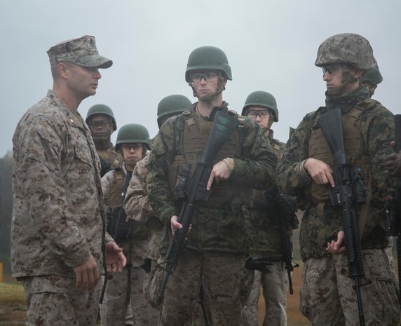 Maj. John Morgan, commanding officer, Headquarters and Service Company, Marine Barracks Washington, D.C., briefs Marines before a modified combat marksmanship shoot at range 14, Marine Corps Base Quantico, Va., Oct. 28, 2015.  The training helped the H&S Marines maintain proficiency on the range and reinforced perishable skills. (U.S. Marine Corps photo by Cpl. Skye Davis/Released)