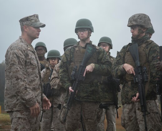 Maj. John Morgan, commanding officer, Headquarters and Service Company, Marine Barracks Washington, D.C., briefs Marines before a modified combat marksmanship shoot at range 14, Marine Corps Base Quantico, Va., Oct. 28, 2015.  The training helped the H&S Marines maintain proficiency on the range and reinforced perishable skills. (U.S. Marine Corps photo by Cpl. Skye Davis/Released)