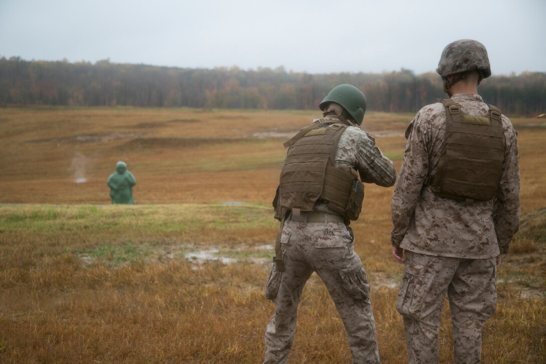 A Marine from Headquarters and Service Company, Marine Barracks Washington, D.C., engages a target with his M-16, service rifle, during a modified combat marksmanship shoot at range 14, Marine Corps Base Quantico, Va., Oct. 28, 2015.  The training helped the H&S Marines maintain proficiency on the range and reinforced perishable skills. (U.S. Marine Corps photo by Cpl. Skye Davis/Released)