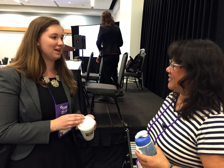 U.S. Army Corps of Engineers employee Lannae Long, an environmental engineer from the Nashville District talks with a college student during the Society of Women Engineers conference Oct. 24, 2015 at the Music City Center Convention Center in Nashville, Tenn.   Long spoke a on "Working with the Federal Government" during a question and answer session Saturday afternoon.  U.S. Army Corps of Engineers representatives networked with thousands of college engineering students at the conference. This year’s theme was “Reach out to reach up.”