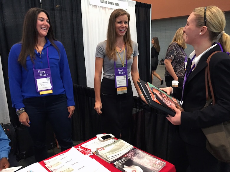 (Left) Meagan Kentner, a civil engineer, in the Management Support Branch, Operations Division and (right) Lacy Thomason, planning project manager, Planning, Formulation Section, both with the Nashville District talk with Katie Lang, an engineering student from Manhattan College in Breezy Point, N.Y., during the Society of Women Engineers conference Oct. 24, 2015 at the Music City Center Convention Center in Nashville, Tenn.  