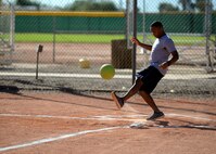 Senior Airman Eric Burrell, 56th Civil Engineer Squadron electrician, kicks the ball during the Combine Federal Campaign kickball tournament against the 56th Security Forces Squadron at Luke Air Force Base, Ariz., Oct. 30, 2015.  The kickball tournament was to raise awareness for the CFC, which support eligible nonprofit organizations that provide health and human service benefits throughout the world. (U.S. Air Force photo by Senior Airman Devante Williams)
