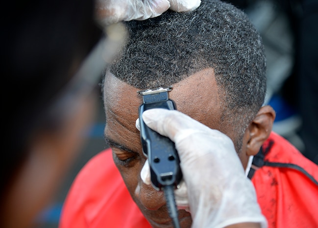 Gregory Griffin receives a haircut during the Veteran Stand Down at the VA Community Resource and Referral Center on Friday, Oct. 30, 2015. (VA Photo by James Arrowood)