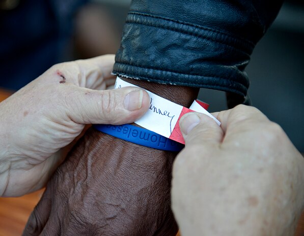 Homeless Veterans are registered and given wristbands at the Veteran Stand Down at the VA Community Resource and Referral Center on Friday, Oct. 30, 2015. The event offered medical screenings and assistance, clothing, food, haircuts and legal counseling to hundreds of homeless veterans in the greater Charleston area.  (VA Photo by James Arrowood)