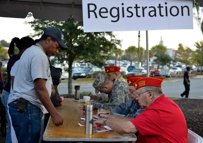 Homeless Veterans are registered and given wristbands at the Veteran Stand Down at the VA Community Resource and Referral Center on Friday, Oct. 30, 2015. The event offered medical screenings and assistance, clothing, food, haircuts and legal counseling to hundreds of homeless veterans in the greater Charleston area.  (VA Photo by James Arrowood)
