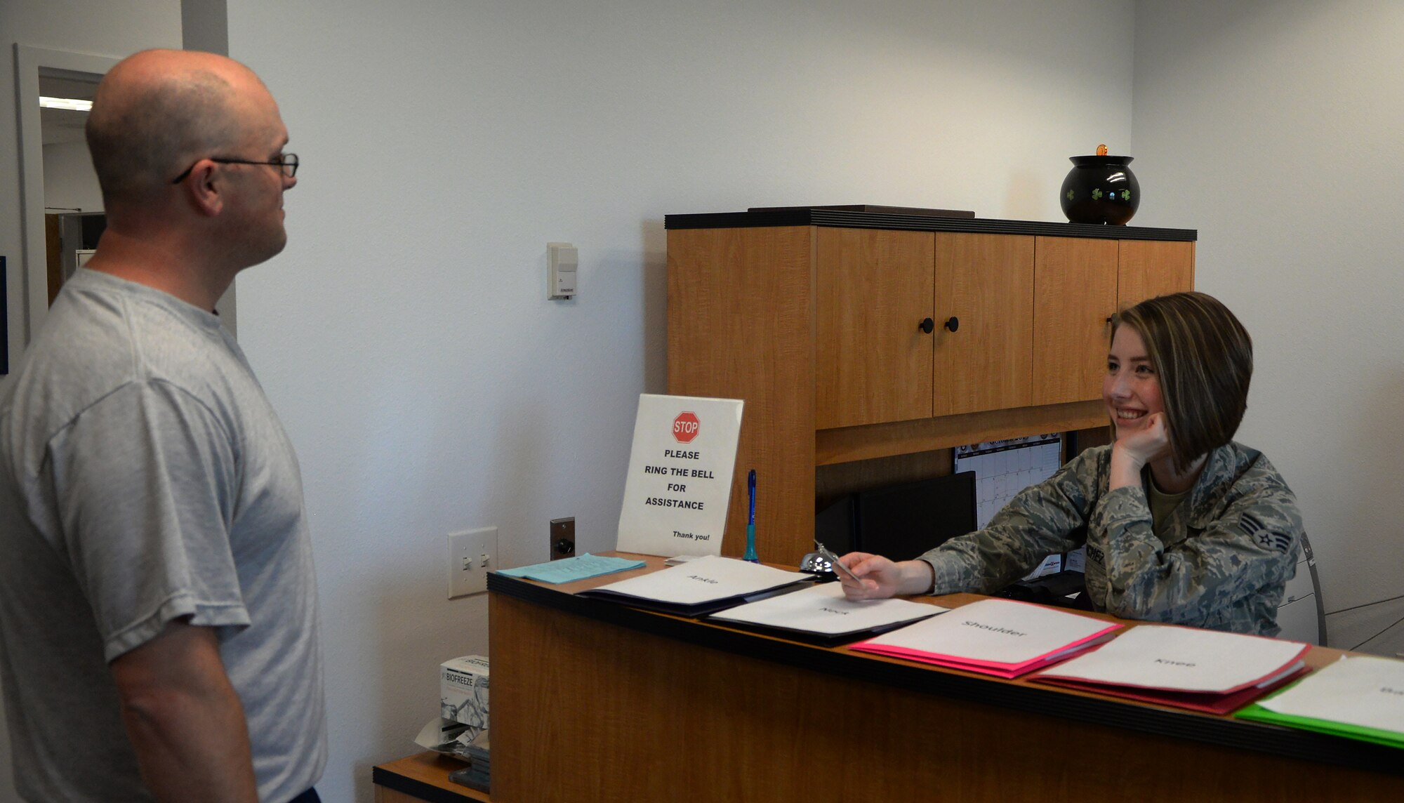 Senior Airman Felicia Sanchez, 90th Medical Operations Squadron Physical Medicine technician, checks in a patient for a physical therapy appointment Oct. 28, 2015, in the physical therapy office in the Freedom Hall Fitness Center on F.E. Warren Air Force Base, Wyo. Airmen who use the walk-in appointment times will be seen for  one injury at a time. (U.S. Air Force photo by Senior Airman Brandon Valle)