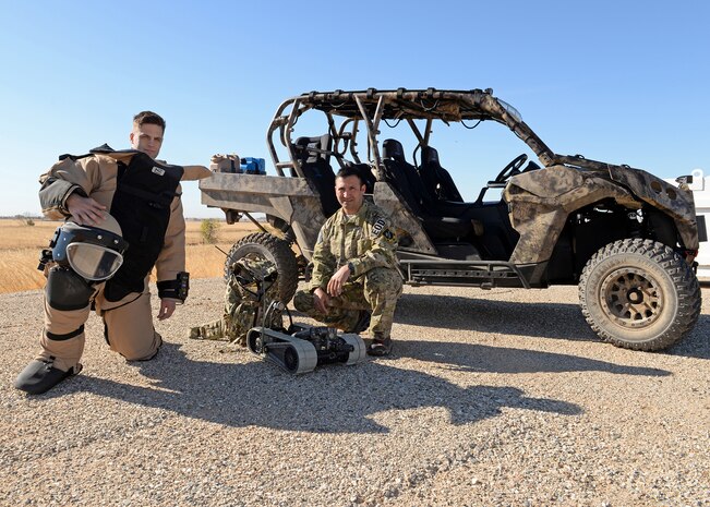 Master Sgt. Jayson Wells (right), 9th Civil Engineer Squadron Explosive Ordnance Disposal flight chief, and Senior Airmen Daniel Fox, 9th CES EOD flight technician, pose for a photo Oct. 29, 2015, at Beale Air Force Base, California. Wells helped and mentored Fox to cross train into the EOD career field. (U.S. Air Force photo by Airman 1st Class Ramon A. Adelan)