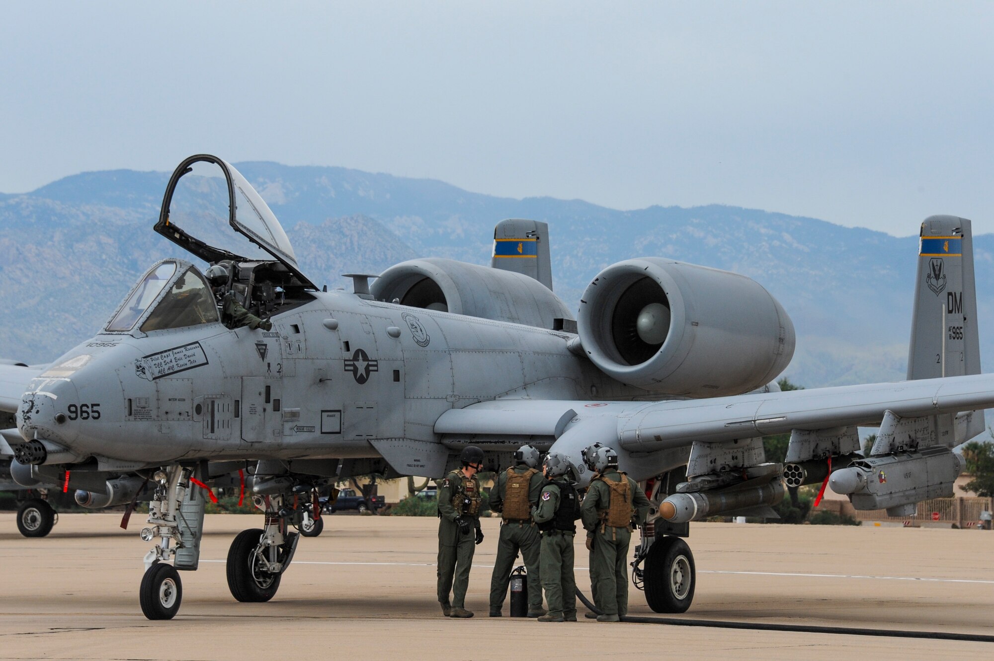A U.S. Air Force A-10C Thunderbolt II pilot from the 354th Fighter Squadron signals to 355th Logistics Readiness Squadron and 563rd Operations Support Squadron Forward Area Refueling Point team members during FARP training at Davis-Monthan Air Force Base, Ariz., Oct. 15, 2015. This is the first time an A-10 was refueled via FARP at D-M. (U.S. Air Force photo by Senior Airman Chris Massey/Released) 