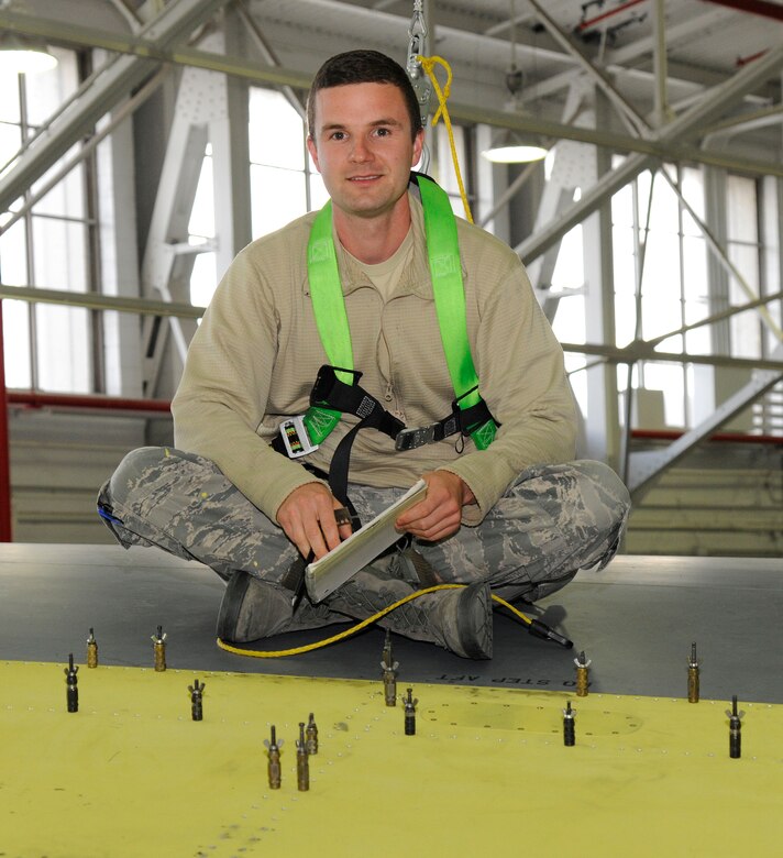 Staff Sgt. Andrew Depew, 127th Aircraft Maintenance Squadron, aircraft structural maintenance craftsman, poses for a photo on the wing of a KC-135 Stratotanker at Selfridge Air National Guard Base, Mich., Oct. 17, 2015. Depew is responsible for any structural repairs or maintenance on the KC-135 Stratotanker. (U.S. Air Force photo by Senior Airman Ryan Zeski/Released)