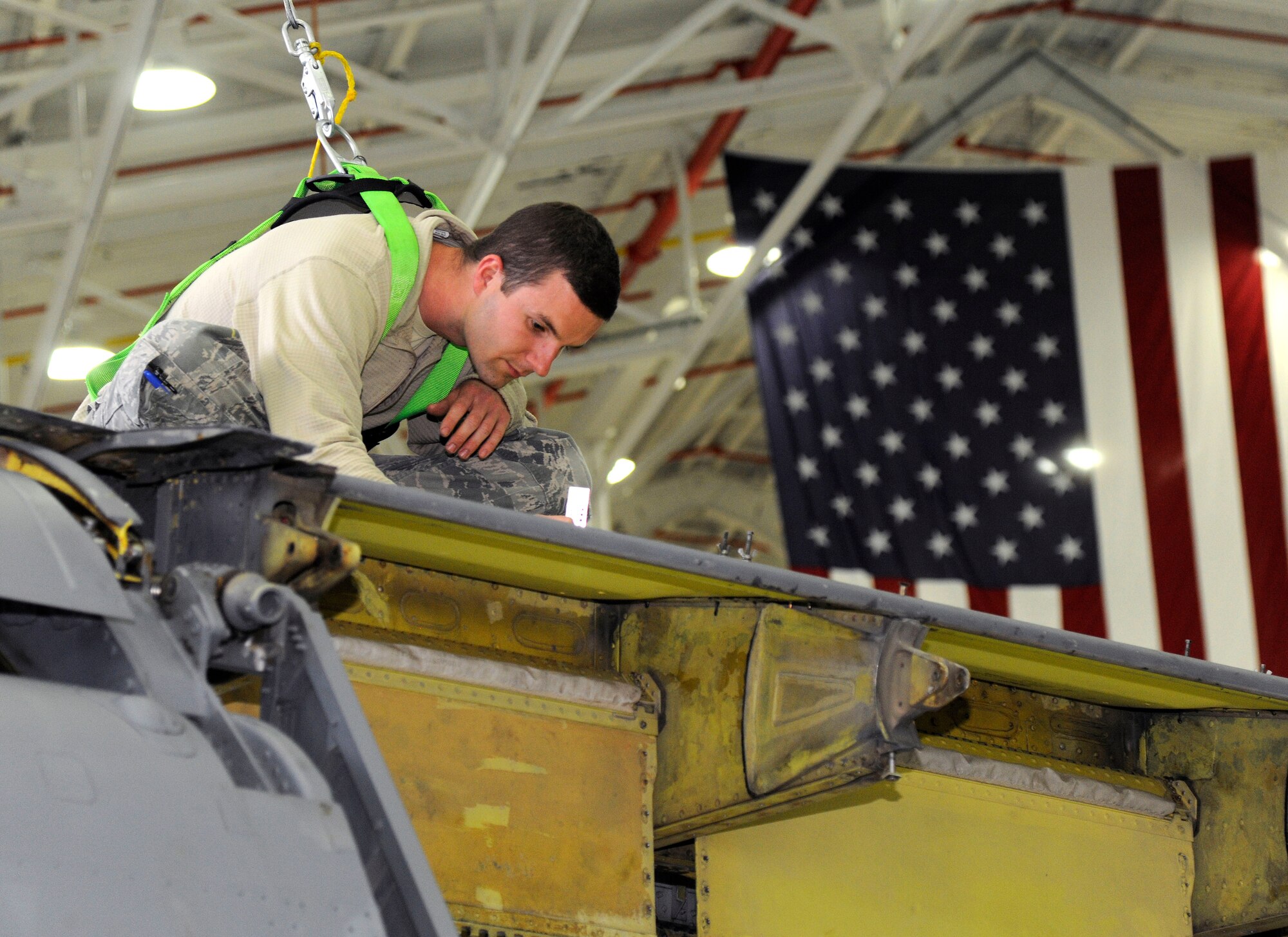 Staff Sgt. Andrew Depew, 127th Aircraft Maintenance Squadron, aircraft structural maintenance craftsman, repairs a panel on a KC-135 Stratotanker in the hangar at Selfridge Air National Guard Base, Mich., Oct. 18, 2015. Depew is responsible for any structural repairs or maintenance on the KC-135 Stratotanker. (U.S. Air Force photo by Senior Airman Ryan Zeski/Released)