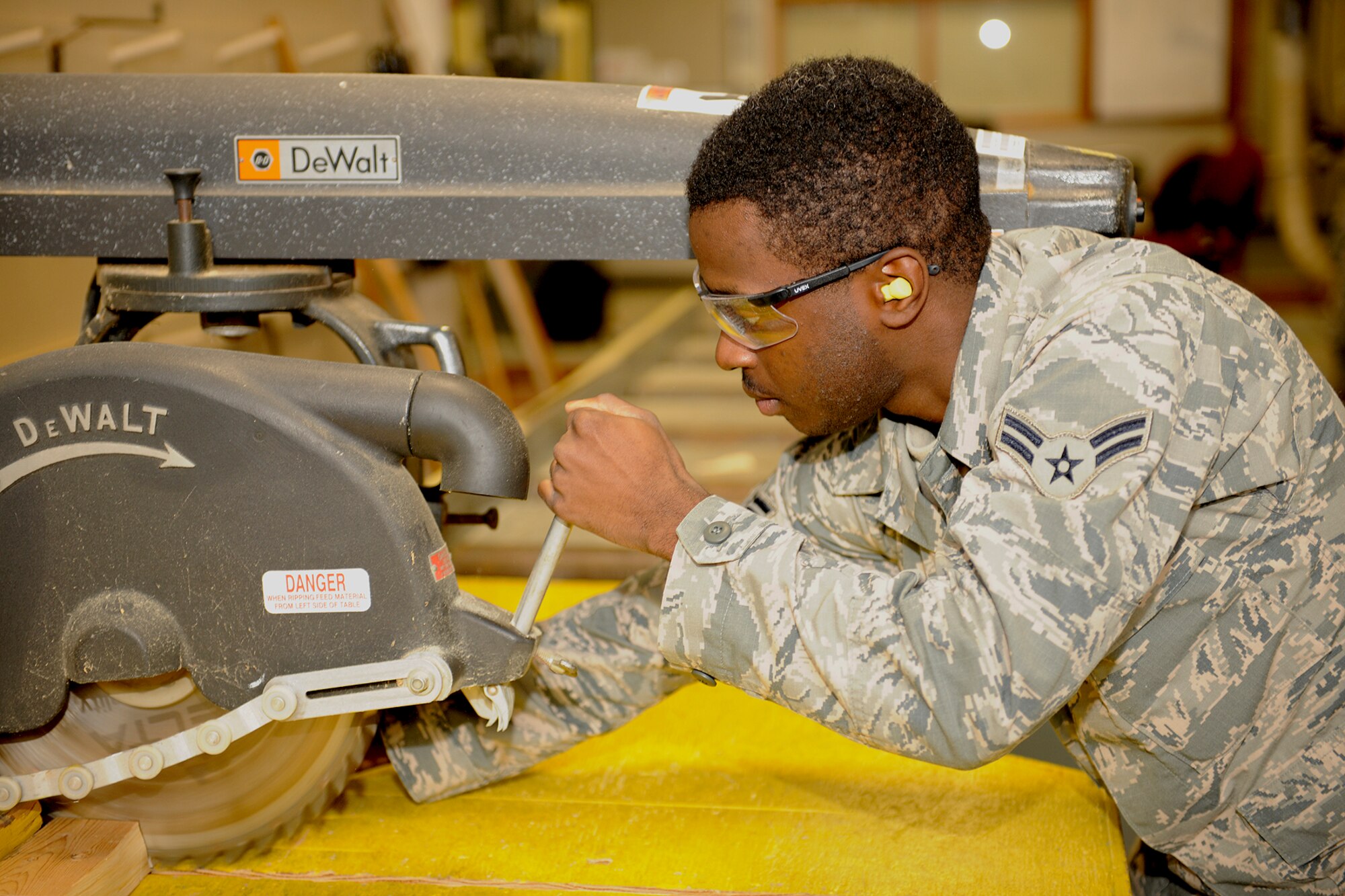 151017-Z-EZ686-018 – Airman 1st Class John Pitts of the 127th Civil Engineering Squadron, Selfridge Mich., is cutting some wood with a table saw at Selfridge Air National Guard Base Mich., October 17, 2015.  Pitts is a newly affiliated member of the CE Squadron, who recently graduated from technician school where he learned the art of working on buildings and structures.  (U.S. Air National Guard photo by MSgt. David Kujawa/Released)
