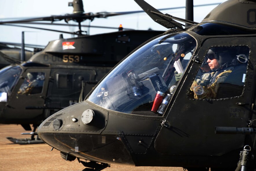 Army aircraft from Fort Bragg, North Carolina line up on the Maxwell flightline while waiting to be re-fueled Oct. 22, 2015 at Maxwell Air Force Base, Alabama. The aircraft included the CH-47 Chinook, UH-60 Black Hawks, AH-64 Apaches, and OH-58 Kiowa Warriors. (U.S. Air Force photo by Airman 1st Class Alexa Culbert)