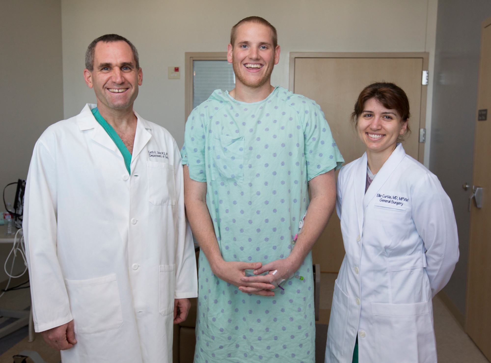 Dr. Garth Utter, left, an associate professor of surgery, Airman 1st Class Spencer Stone, center, and Capt. (Dr.) Eleanor Curtis, a senior resident at UC Davis Medical Center who is assigned to David Grant USAF Medical Center at Travis Air Force Base, Calif., pose for a photo earlier this month. (Courtesy photo)