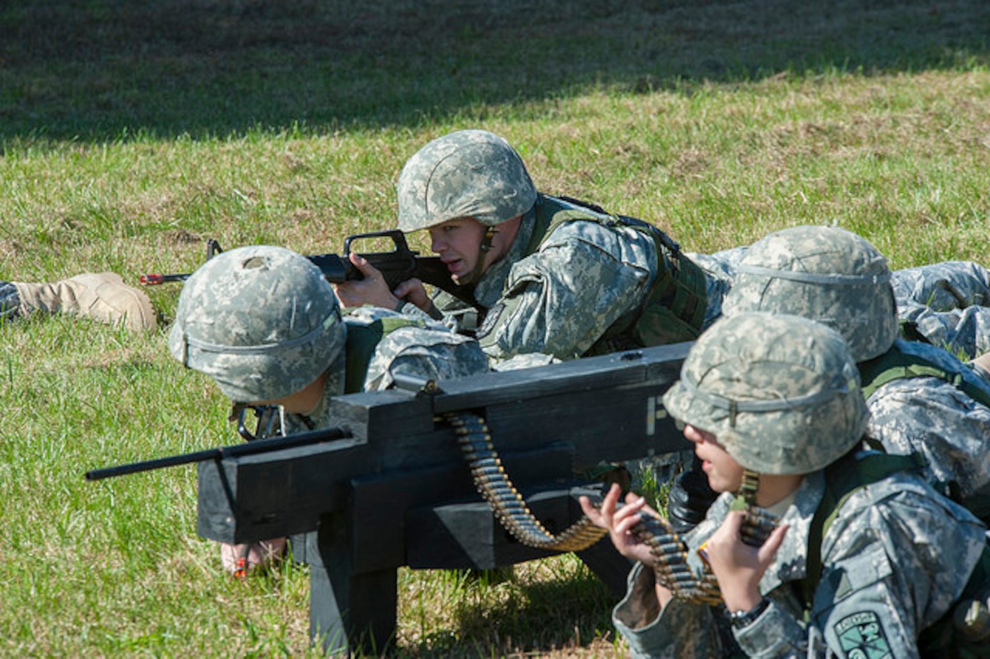Cadets practice bounding with a wooden machine gun created by his team at the 2015 ROTC Ranger Challenge at Joint Base McGuire-Dix-Lakehurst, N.J. Oct. 17, 2015. Forty-two colleges participated in 10 different events and the top nine-man team will compete in the Sandhurst Competition at West Point in 2016. (U.S. Air Force photo by 2nd Lt. Rachel Salpietra/Released)