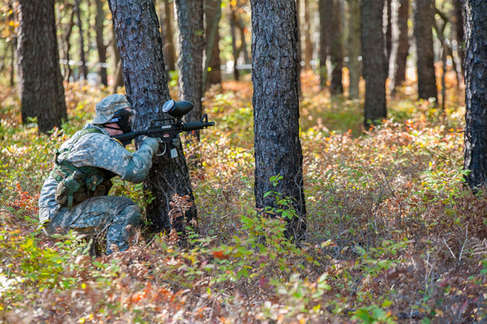 A cadet evades an opposing paintball team during the 2015 ROTC Ranger Challenge at Joint Base McGuire-Dix-Lakehurst, N.J. Oct. 17, 2015. Forty-two colleges participated in 10 different events and the top nine-man team will compete in the Sandhurst Competition at West Point in 2016. (U.S. Air Force photo by 2nd Lt. Rachel Salpietra/Released)