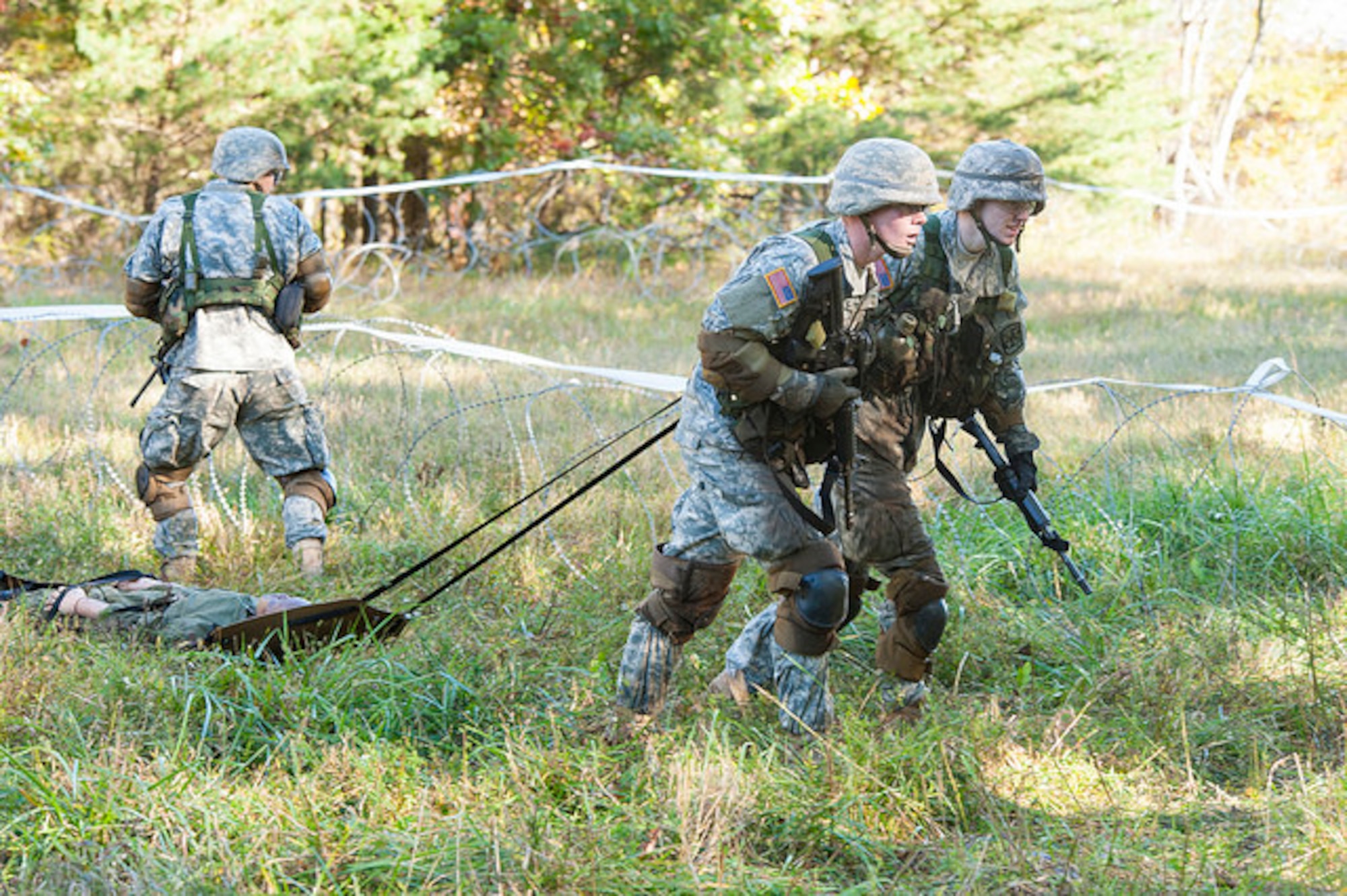 Cadets drag a simulated victim on a skid during the 2015 ROTC Ranger Challenge at Joint Base McGuire-Dix-Lakehurst, N.J. Oct. 17, 2015. Forty-two colleges participated in 10 different events and the top nine-man team will compete in the Sandhurst Competition at West Point in 2016. (U.S. Air Force photo by 2nd Lt. Rachel Salpietra/Released)