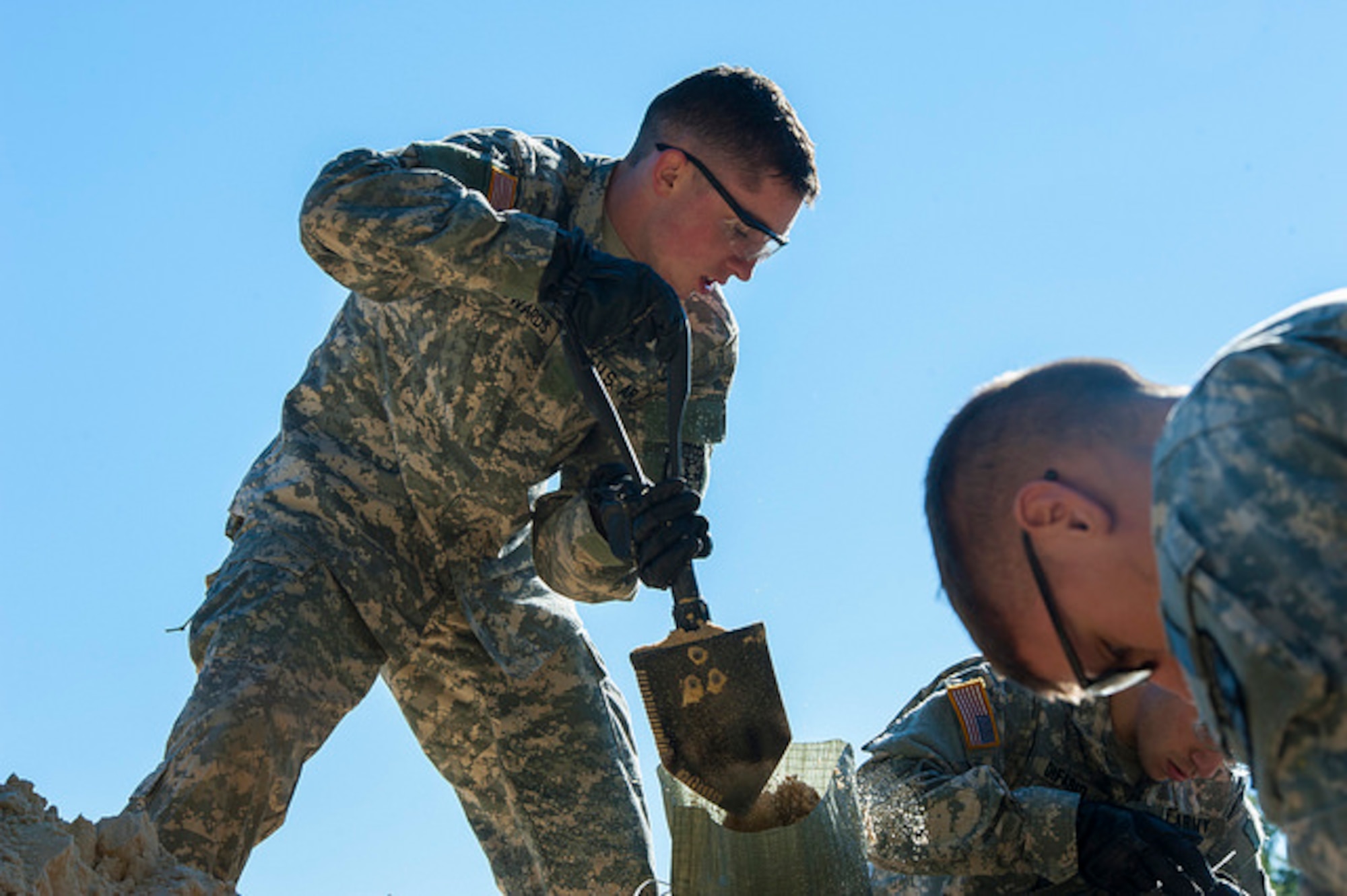 Cadets fill sandbags during the 2015 ROTC Ranger Challenge at Joint Base McGuire-Dix-Lakehurst, N.J. Oct. 17, 2015. Forty-two colleges participated in 10 different events and the top nine-man team will compete in the Sandhurst Competition at West Point in 2016. (U.S. Air Force photo by 2nd Lt. Rachel Salpietra/Released)
