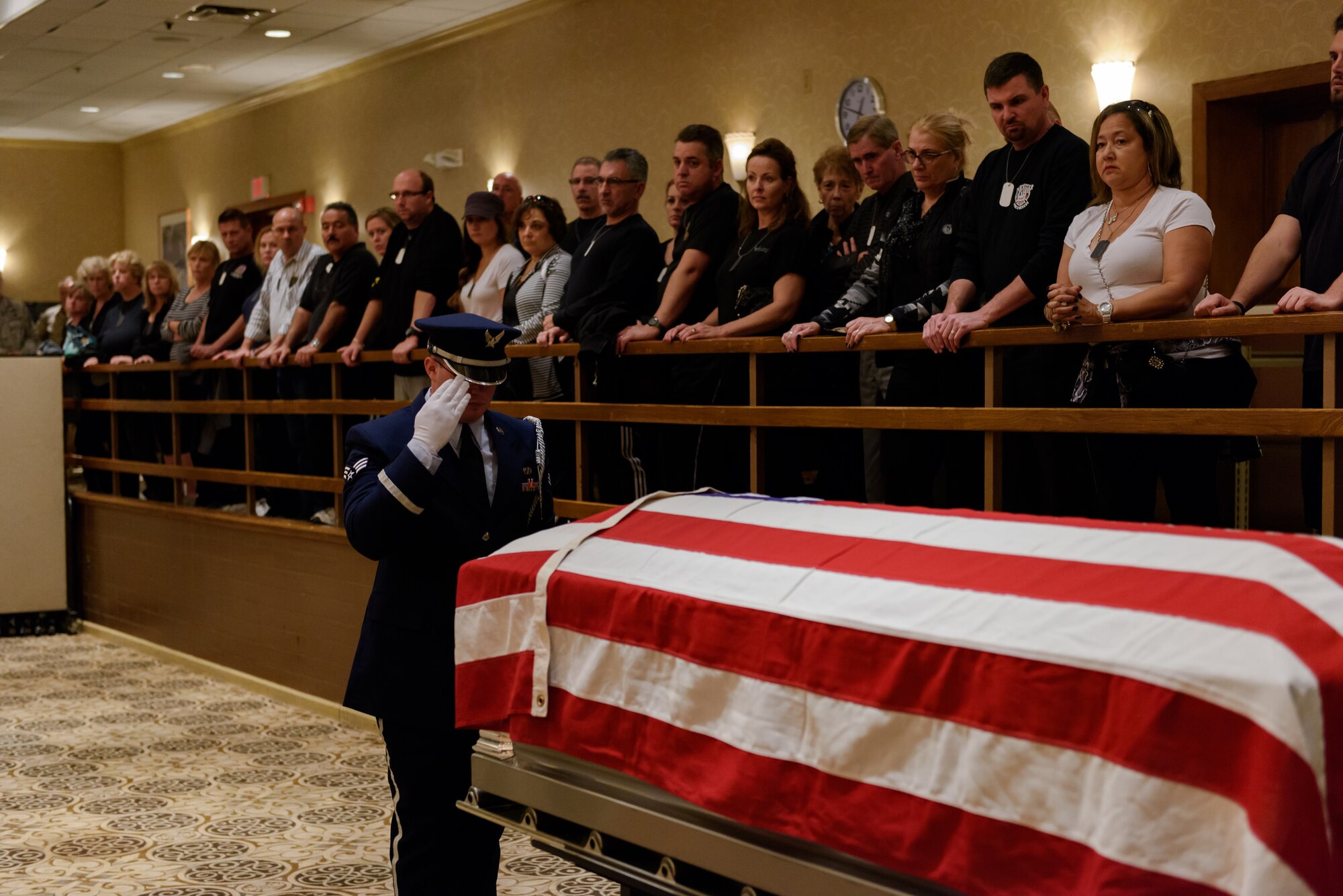 Civic leaders watch a military funeral demonstration by the base honor guard during the Honorary Commanders Boot Camp event Oct. 29, 2015, at Joint Base McGuire-Dix-Lakehurst, N.J. Thirty-eight leaders from the local community participated in the event, during which they learned fundamentals of military customs and traditions. (U.S. Air Force photo by Robert Williard/Released)