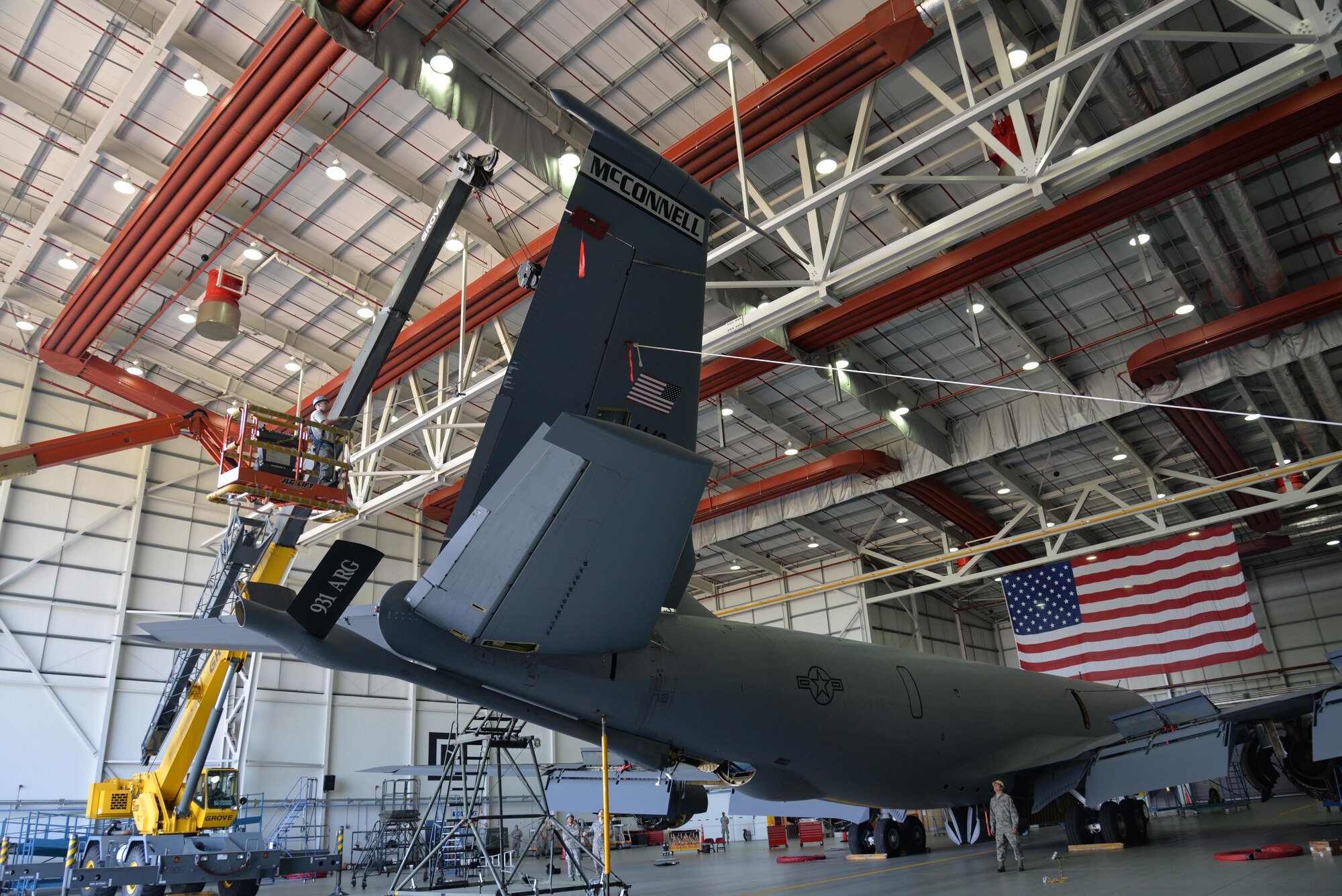 U.S. Air Force Airmen from the 100th Maintenance Squadron and 100th Aircraft Maintenance Squadron work together to perform a “fin fold” tail removal of a KC-135 Stratotanker, tail number 10267, Sept. 11, 2015, on RAF Mildenhall, England. The jet, formerly from McConnell Air Force Base, Kan.,was reassigned to RAF Mildenhall and underwent a full isochronal inspection. The jet has now been repainted and given the Square D, RAF Mildenhall station patch, and heritage emblem markings. (U.S. Air Force photo by Karen Abeyasekere/Released)