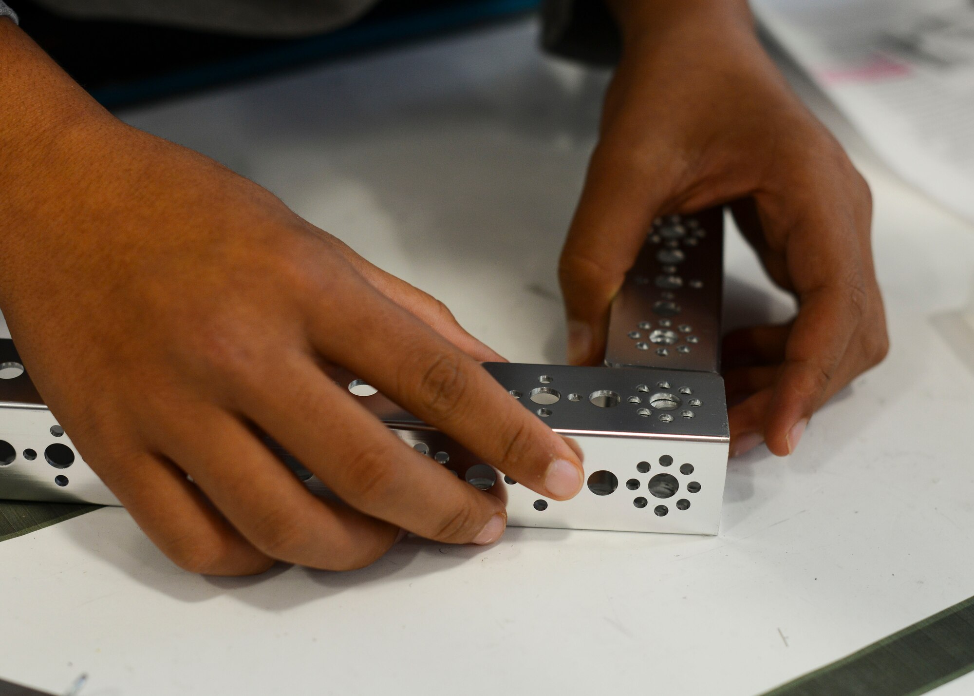 Kyle Elwood, Aviano High School student, builds a robot’s frame during a robotics club session, Sept. 30, 2015, at Aviano Air Base, Italy. Students build robots throughout the school year to participate in competitions around the world. (U.S. Air Force photo by Senior Airman Austin Harvill/Released)