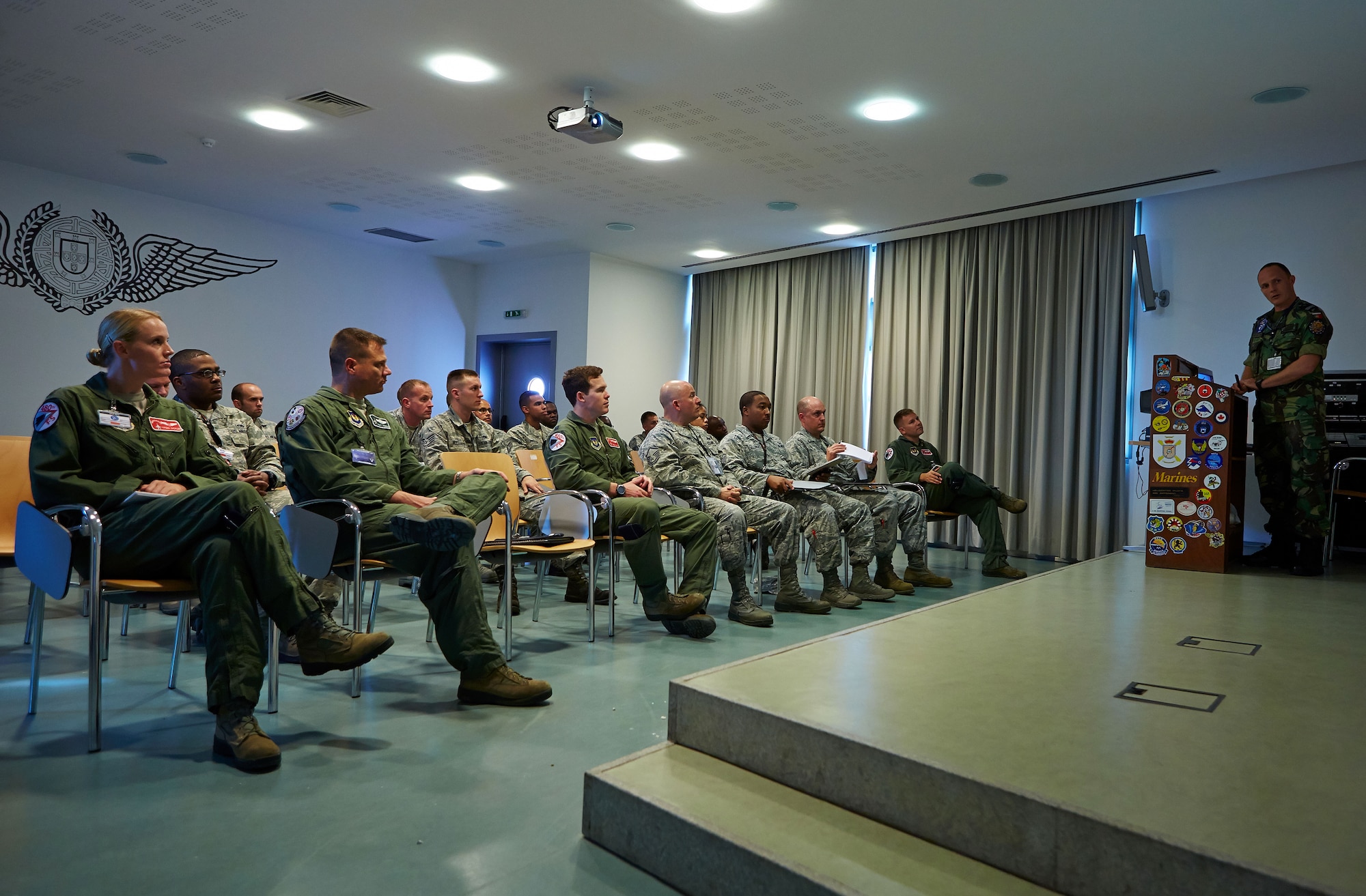 BEJA AIR BASE, Portugal – Members of the 52nd Fighter Wing, Spangdahlem Air Base, Germany, attend an in-processing brief, Oct. 15, 2015, before the start of Exercise Trident Juncture 2015. More than 3,000 military members from eight nations and 40 aircraft are deployed to Beja, Portugal in support this annual NATO Response Force certification exercise. (Photo courtesy of Portuguese Air Force public affairs/ Released)