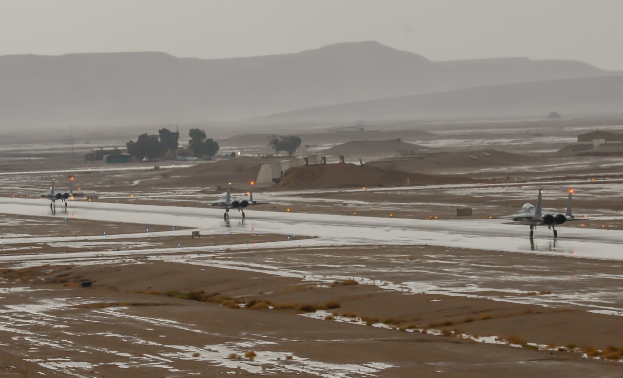F-15C Eagles from the 493rd Fighter Squadron, Royal Air Force Lakenheath, England, taxi down the runway after completing a training mission during the Blue Flag exercise at Uvda Air Force Base, Israel, Oct. 18-29, 2015. Blue Flag is the Israeli air force's largest multinational aerial exercise and involved 11  Israeli, Hellenic, Polish and U.S. air forces . (U.S. Air Force photo by 2nd Lieutenant Kellie Rizer/Released)