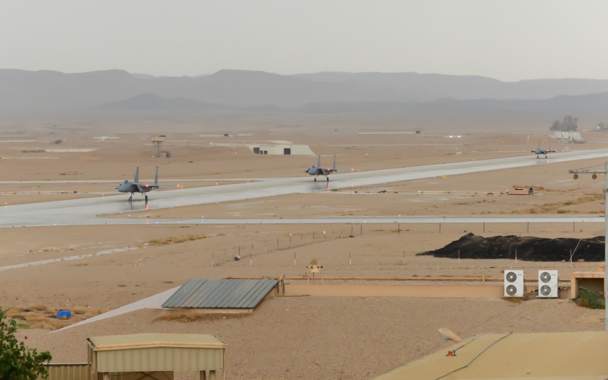 F-15C Eagles from the 493rd Fighter Squadron, Royal Air Force Lakenheath, England, taxi down the runway after completing a training mission during the Blue Flag exercise at Uvda Air Force Base, Israel, Oct. 18-29, 2015. Blue Flag is the Israeli air force's largest multinational aerial exercise and involved 11 fighter squadrons representing the Israeli, Hellenic, Polish and U.S. air forces. (U.S. Air Force photo by 2nd Lieutenant Kellie Rizer/Released)