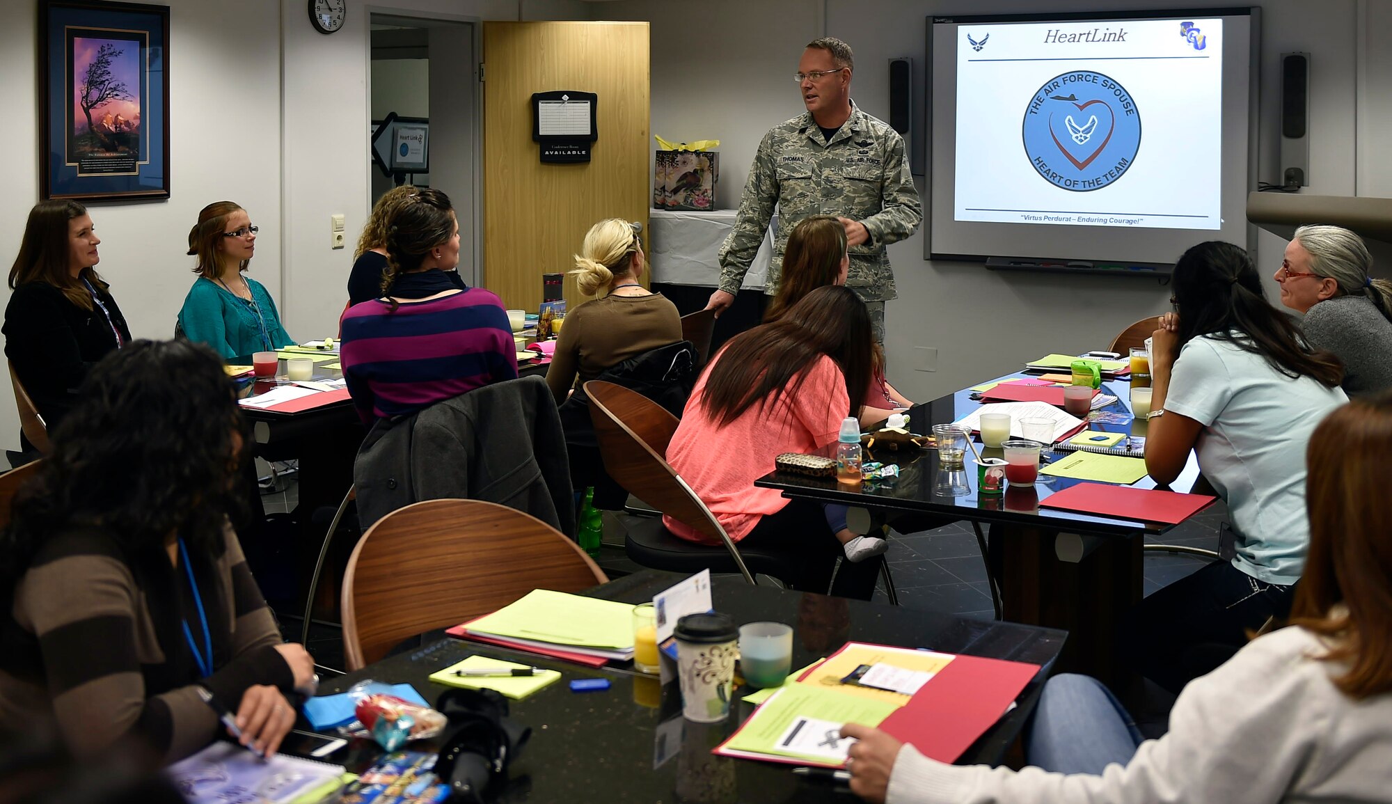 Brig. Gen. Jon T. Thomas, 86th Airlift Wing commander, talks to spouses graduating from the HeartLink program and explains how important their contribution is to Ramstein Air Base, Oct. 23, 2015. The HeartLink program covers essential items that will help Air Force spouses get to know their surroundings and adjust to Air Force life at Ramstein with ease. (U.S. Air Force photo/Senior Airman Damon Kasberg)